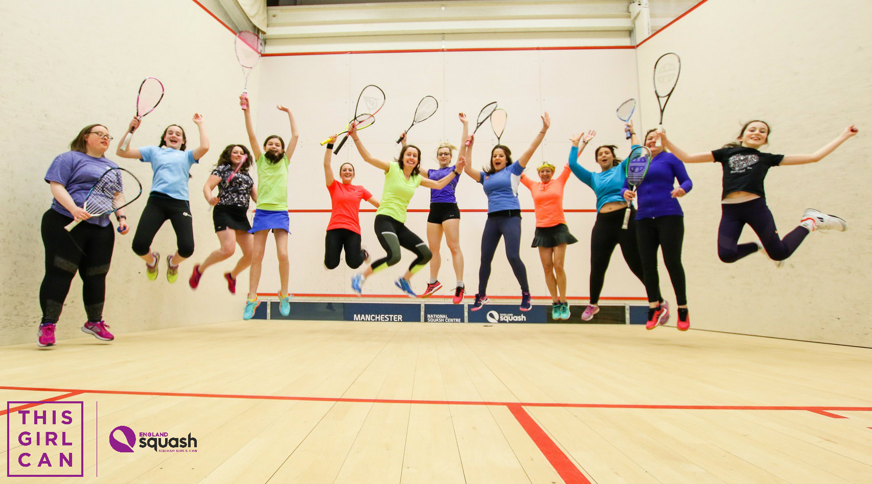 Image of female squash players jumping in the air